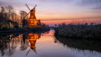 Illuminated Mills of Greetsiel, Germany - desktop wallpaper